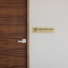 2 by 8 Plastic Sign By A Door As A Name Plate