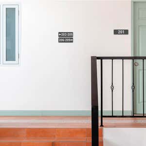 Gray 2 by 6 Plastic Signs Showing Room Numbers