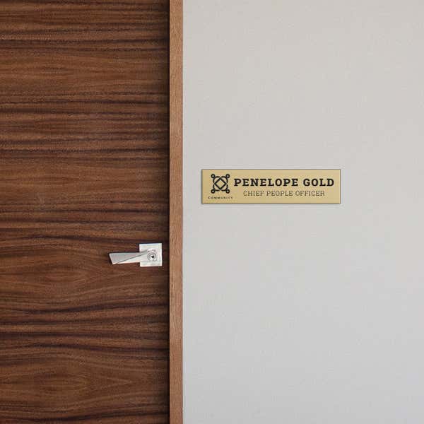 2 by 8 Plastic Sign By A Door As A Name Plate