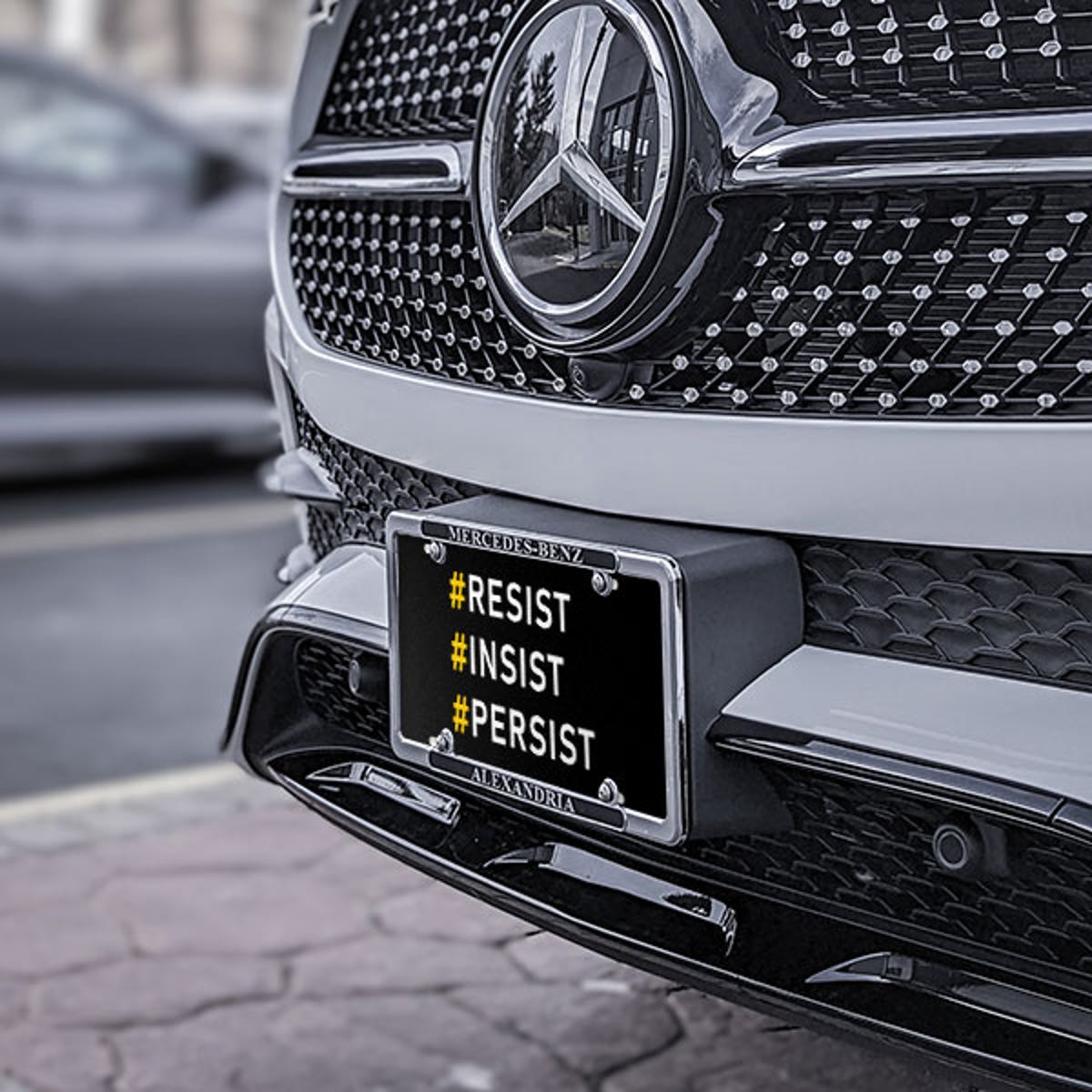Front License Plate On Black Car