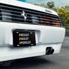 Front License Plate On White Car