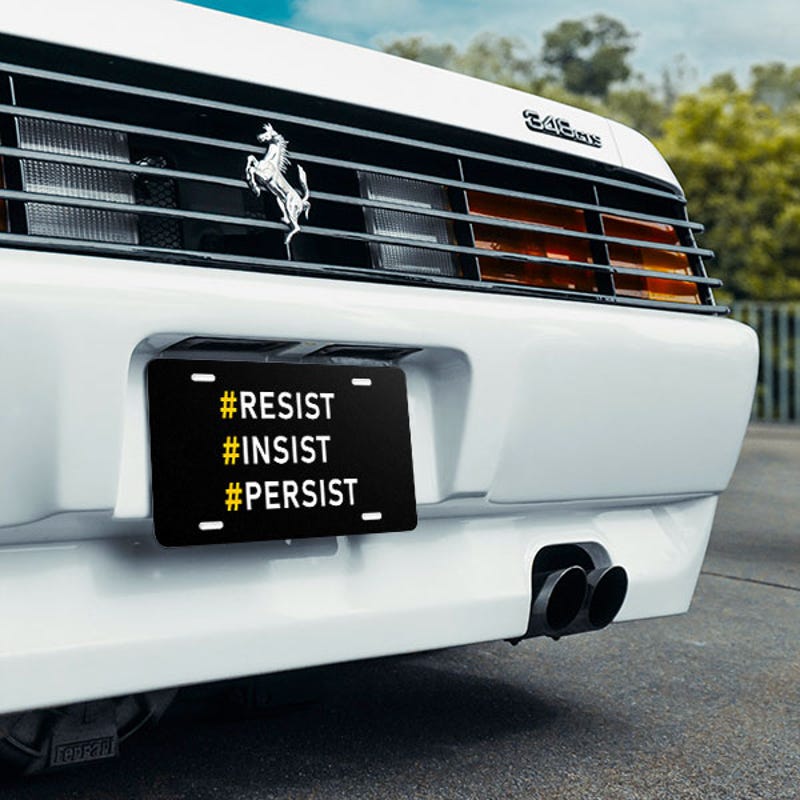 Front License Plate On White Car