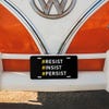 Front License Plate On Orange Car