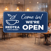 An engraved plastic sign with a coffee shop logo 
