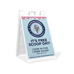 A sandwich board sign for an ice cream shop featuring their logo